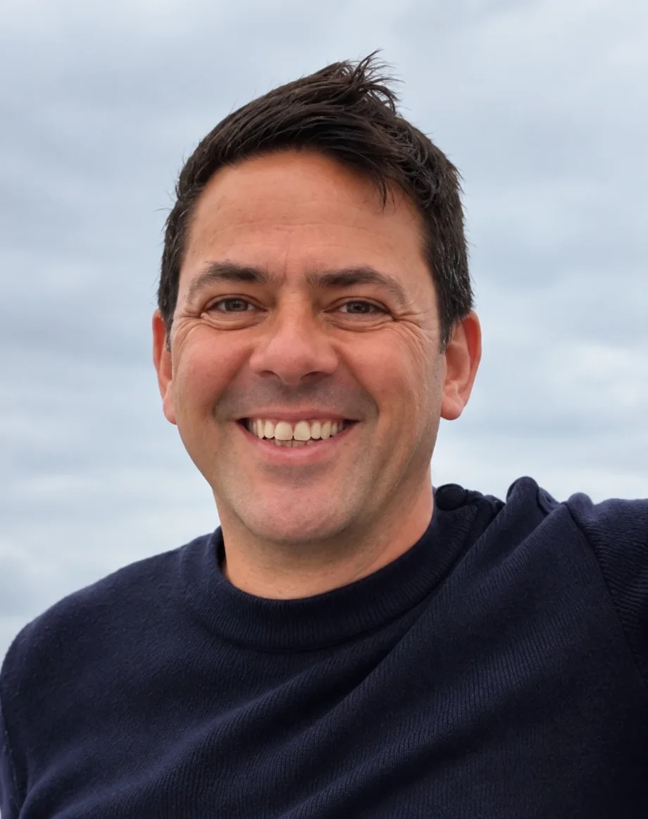 Steve Harding, founder of Saltlog, smiling under a grey Dorset sky